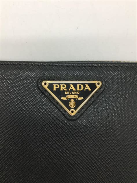 prada portafoglio lampo 1ml506|Prada PORTAFOGLIO LAMPO Saffiano Leather Round Long .